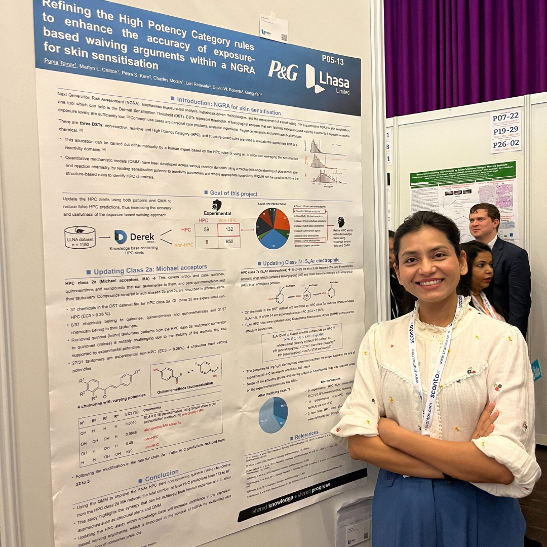 Female in front of NGRA poster at Eurotox