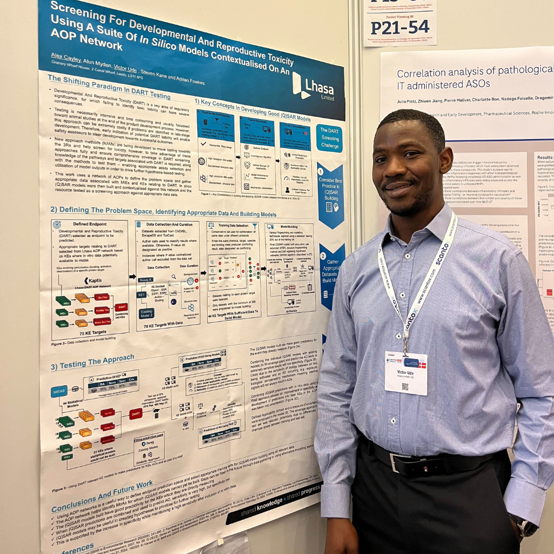 Male in front of AOP poster at Eurotox