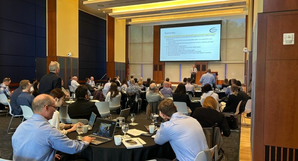 Crowd watching speaker at the conference